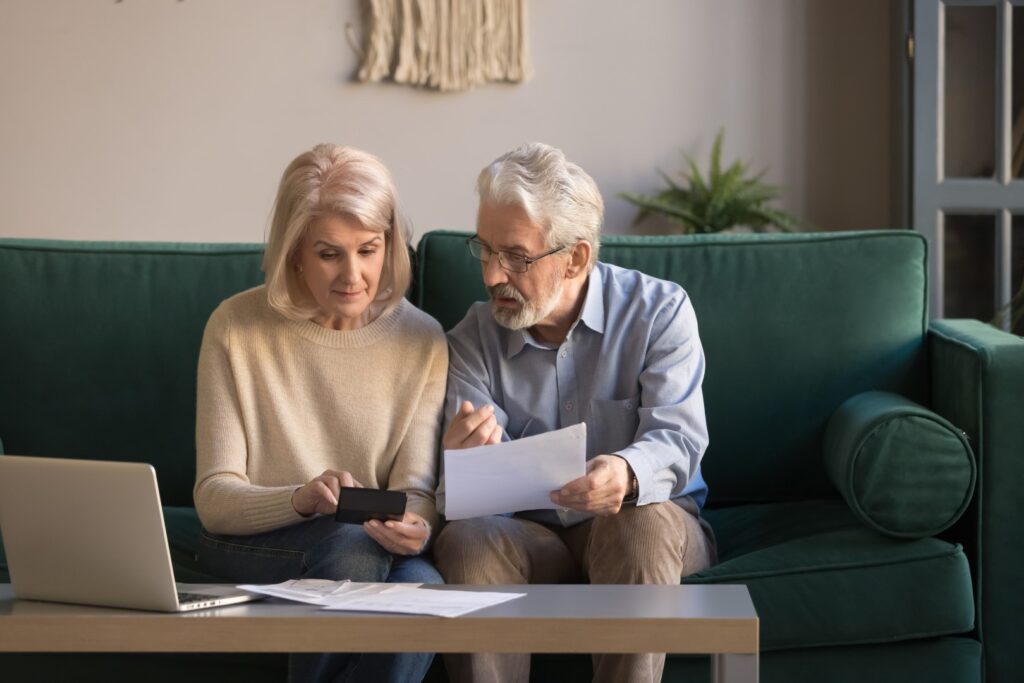 Senior couple analyzing retirement savings